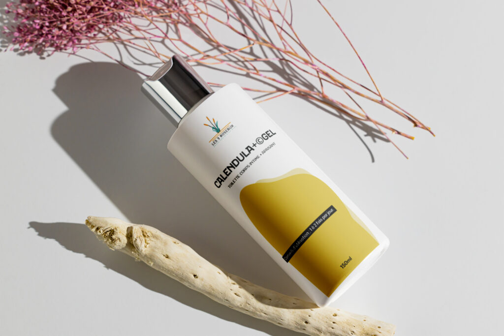 Bouteille de gel calendula blanche avec une étiquette jaune
